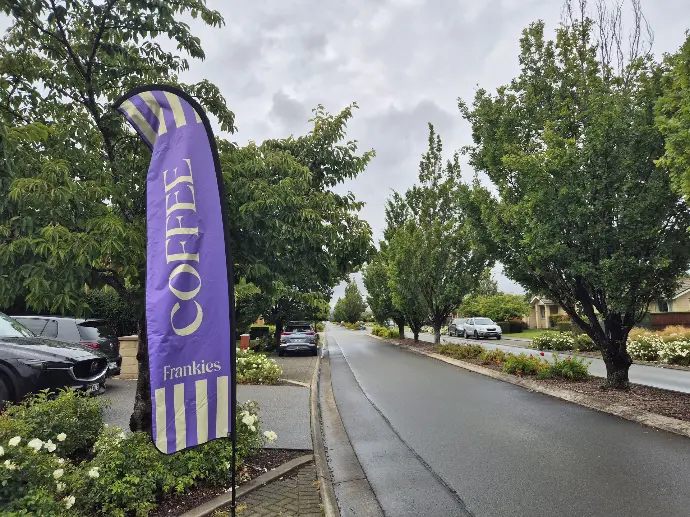Teardrop flag for Frankies Coffee Cart, a small business located in Prebbleton, Christchurch. The teardrop flag features bold colouring and our durable flag fabrics.